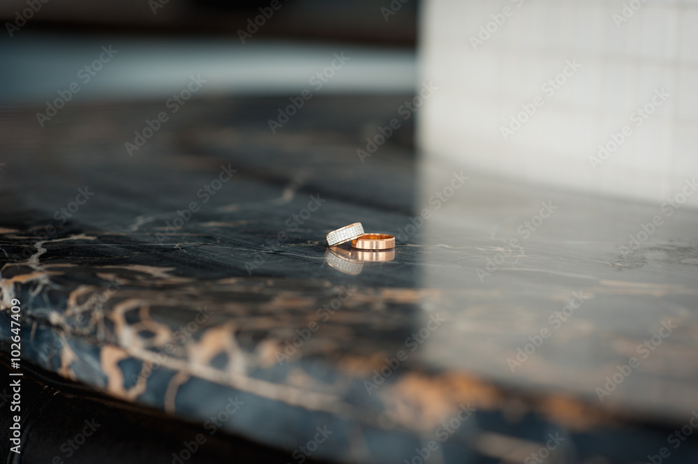 pair of wedding rings with bokeh background pair of wedding rings with bokeh background