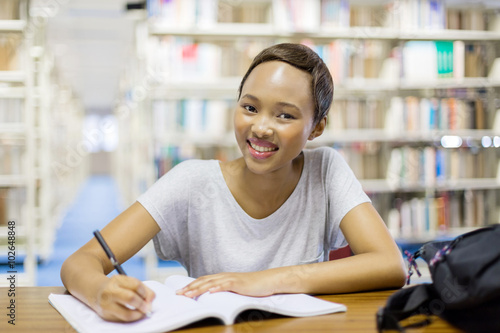 african american university student in library