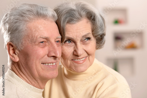 Elderly people sitting on couch