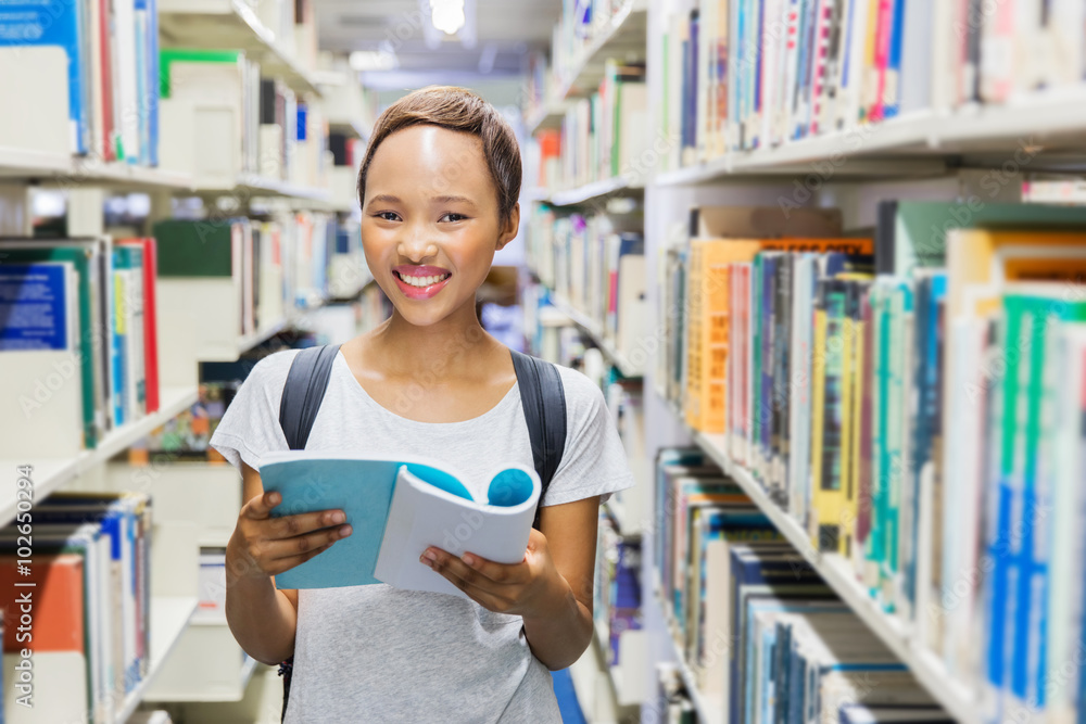 female african american student in university library female african american student in university library