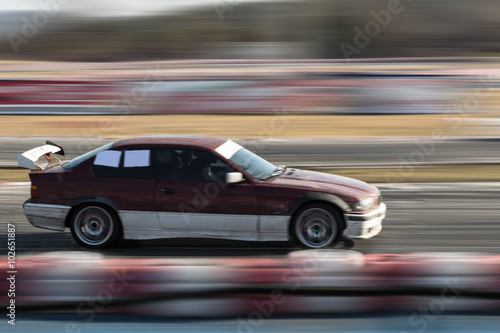 Obraz na plátně Car moving fast on the track
