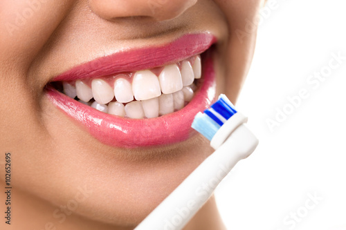 Close up of perfect teeth during brushing