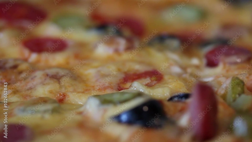 taking slice of pizza,melted cheese dripping taking slice of pizza,melted cheese dripping