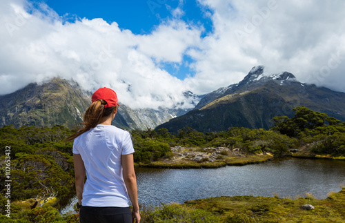 Obraz na płótnie Woman hiker enjoys the view of Key Summit with Ailsa Mountain at