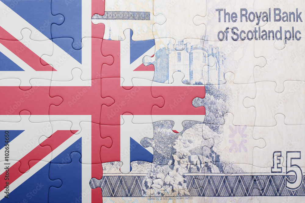 Obraz premium puzzle with the national flag of great britain and scottish banknote