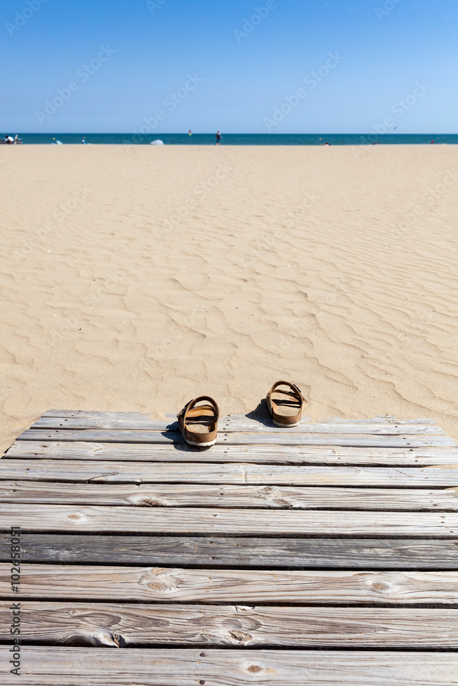 Obraz premium Summer sandals on beach