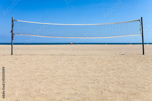 Volleyball net on beach photo