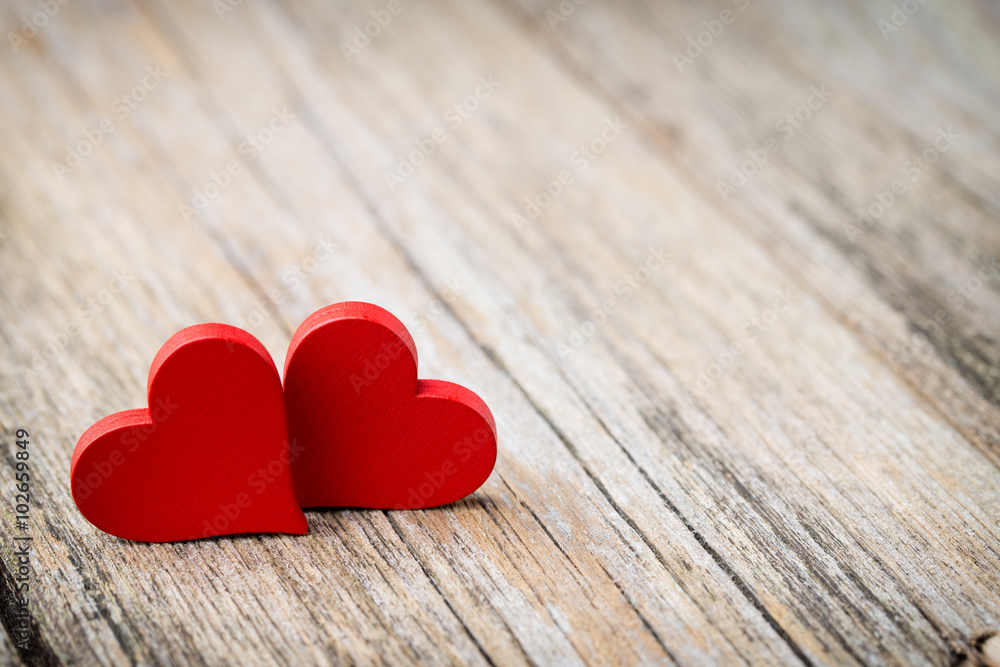 Red heart-shaped on a wooden background. Red heart-shaped on a wooden background.