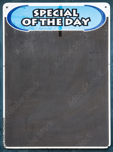 Slika na platnu Well used Black chalkboard advertising the special of the day
