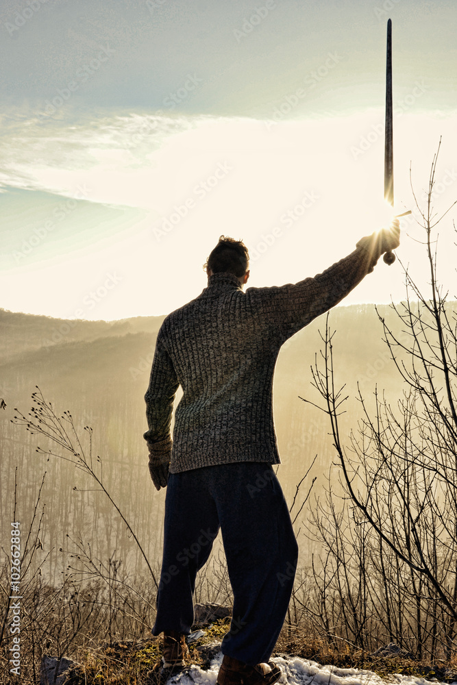Young man holding sword, Knight stay on the wall with weapon, Sword