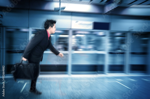 Motion blur Asian businessman in a subway