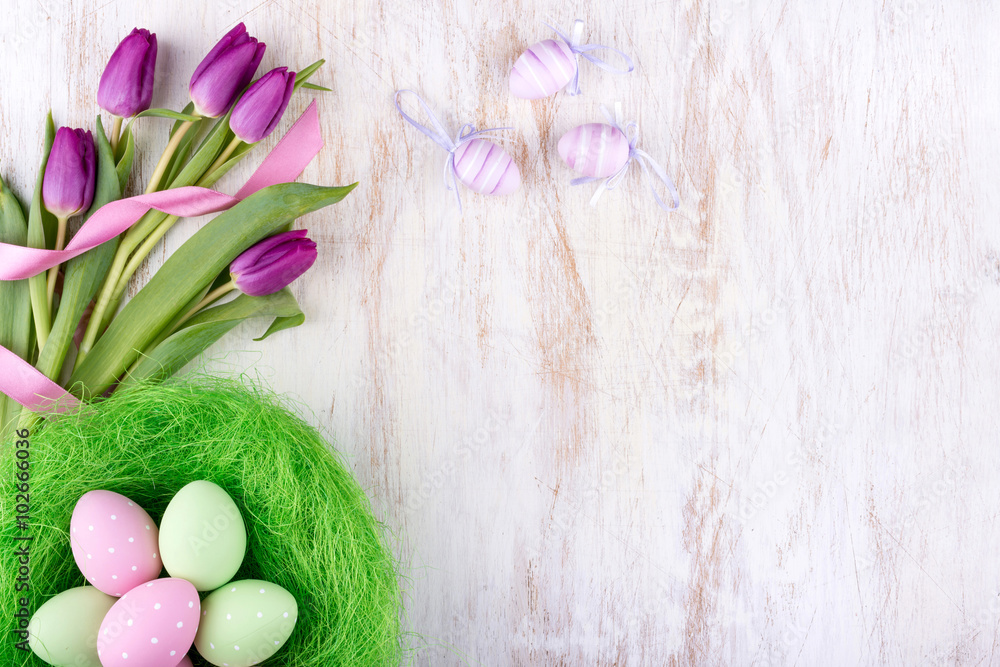 easter eggs and flowers over white wooden table easter eggs and flowers over white wooden table