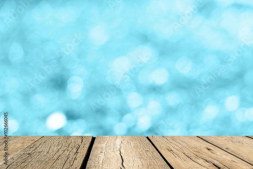 Blue Empty perspective room with sparkling bokeh wall and wooden