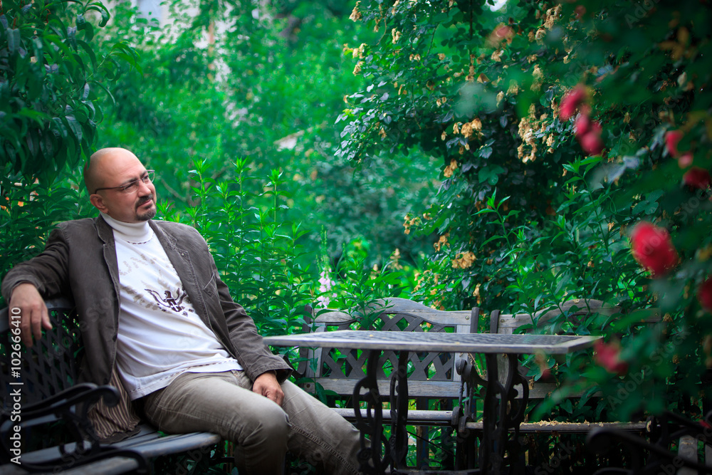 old man siting in park old man siting in park