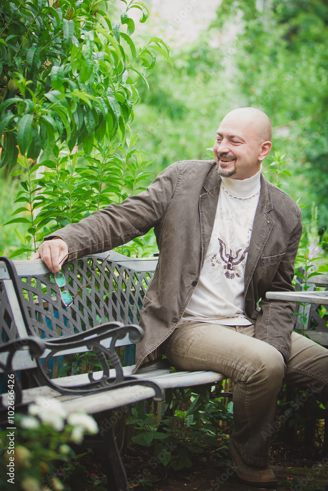 Fototapeta premium old man smiling in park