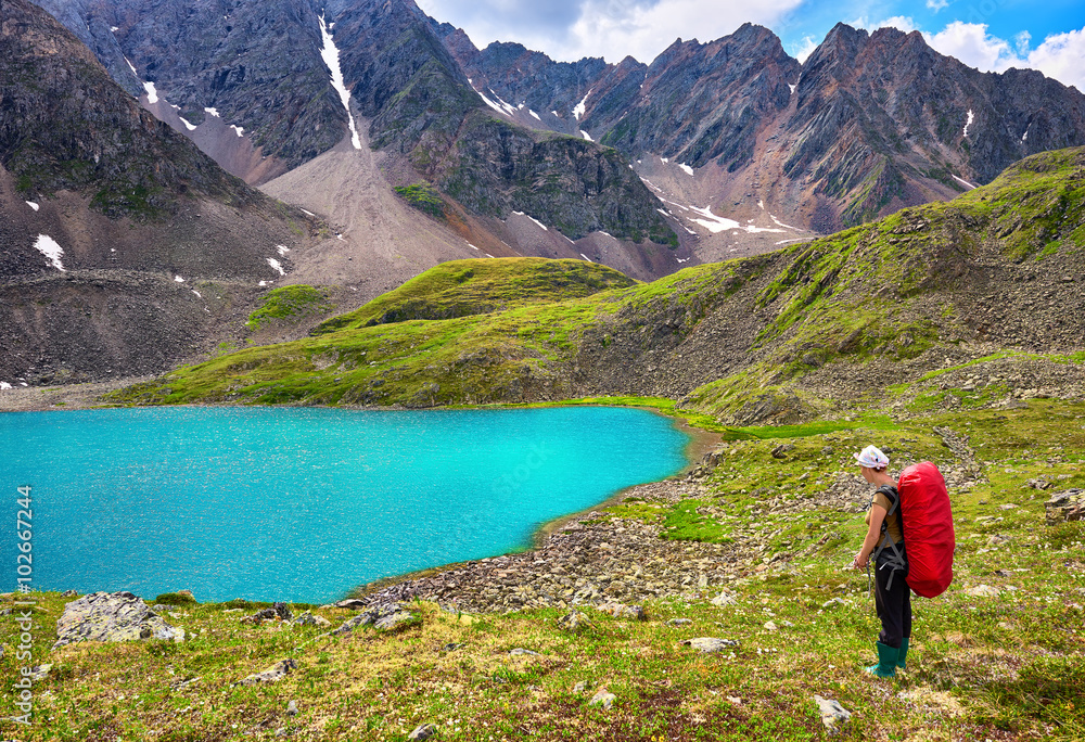 Mountain hiking. Woman and pristine Siberian nature