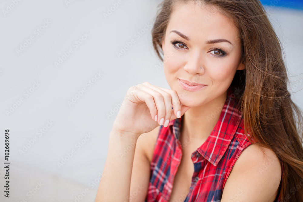 A young woman with a beautiful smile,a portrait outdoors A young woman with a beautiful smile,a portrait outdoors