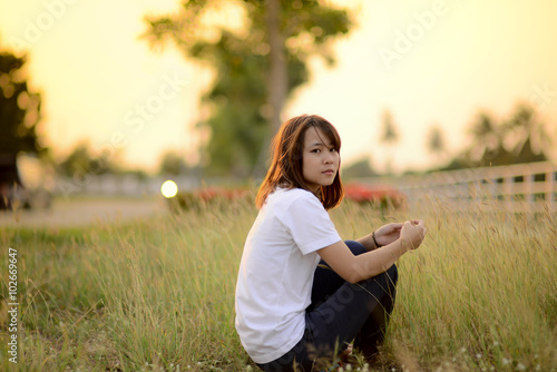 Portrait of Asian teenager outdoor during sun set.