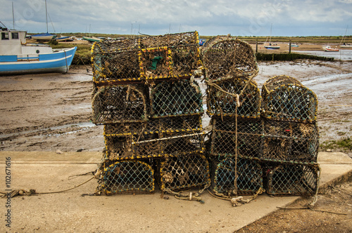 Old Lobster pots at Brancaster Norfolk England photo