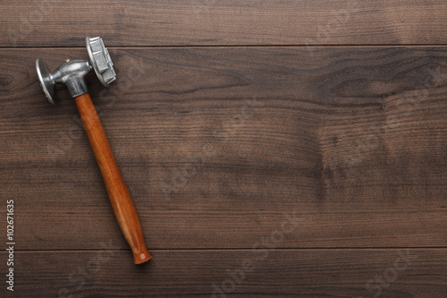 kitchen hammer on the brown wooden table