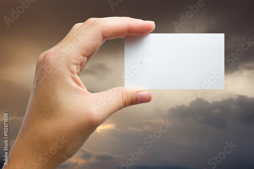 Wallpaper Mural Hand holding white business card on blurred background Torontodigital.ca