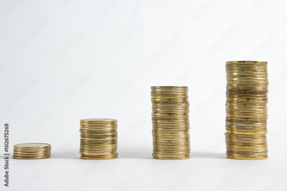 Columns of golden and silver coins isolated on white background. Money concept, investment bank Columns of golden and silver coins isolated on white background. Money concept, investment bank