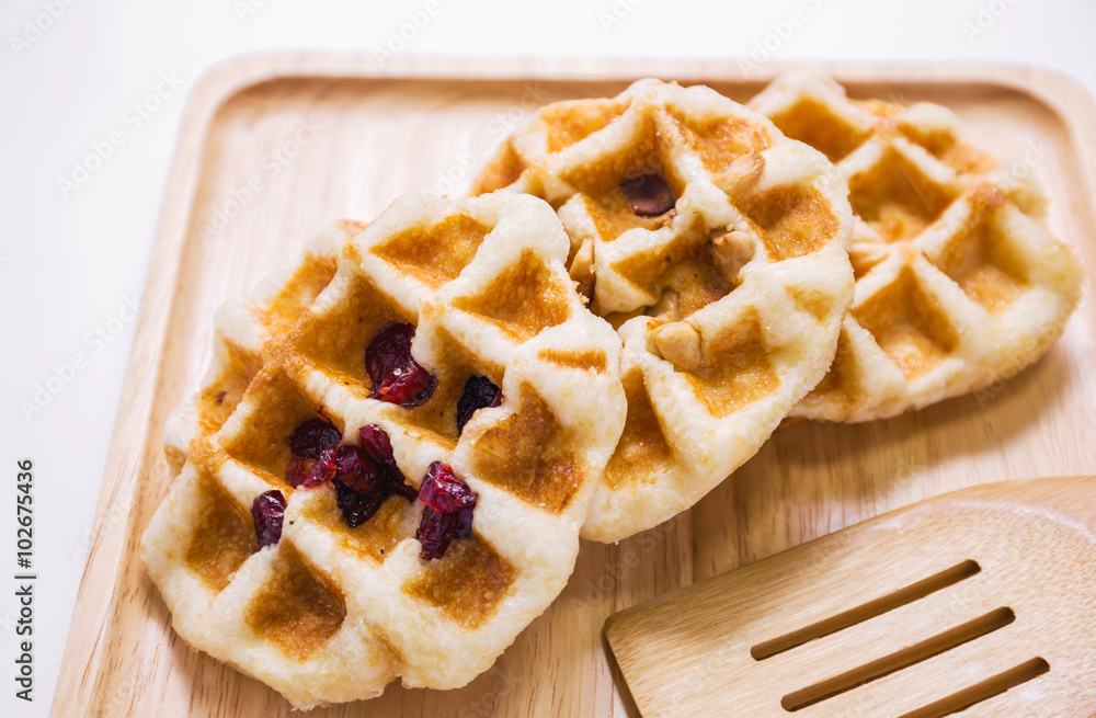 Almond, nut and cranberry waffle on the plate Almond, nut and cranberry waffle on the plate