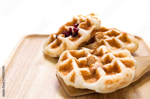Almond, nut and cranberry waffle on the plate