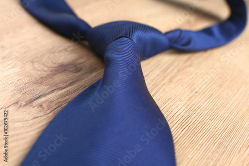 Elegance ties on wooden table, closeup