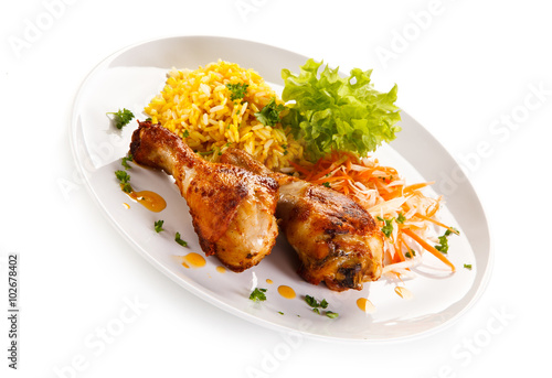 Roasted chicken drumsticks white rice and vegetables