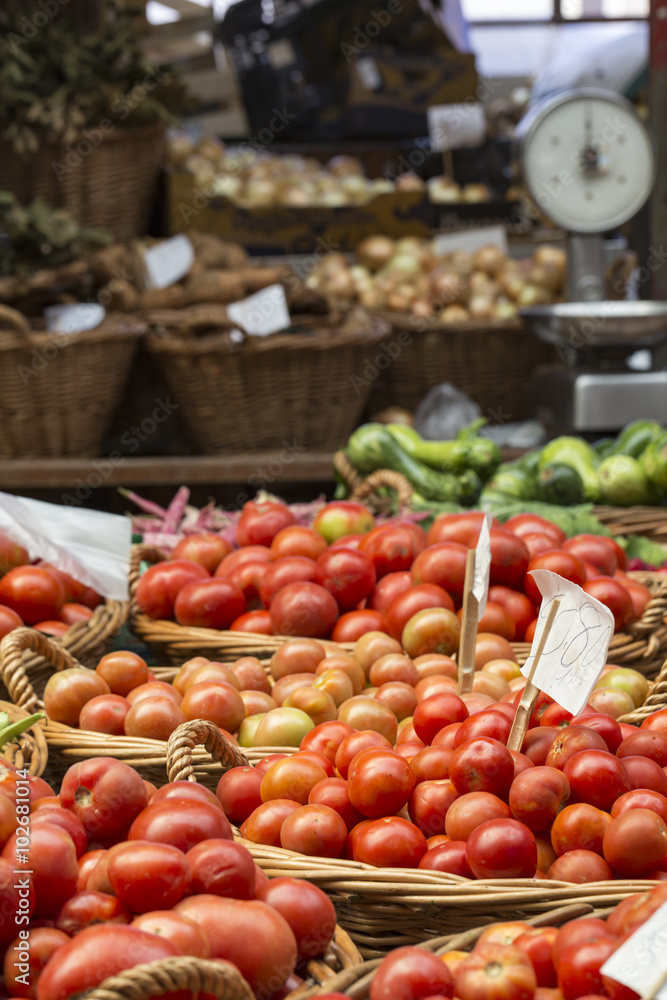 Fresh tomatoes in a market stall.