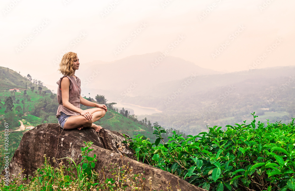 Young woman on tea plantation and beautiful view. Sri-Lanka