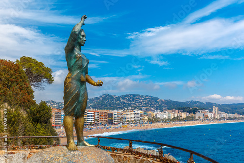 Dona marinera, monument to the Fishermans Wife one of the towns most emblematic symbols at popular holiday resort Lloret de Mar on Costa Brava in the morning , Catalunya, Spain photo