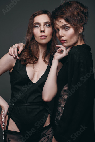 Portrait of two beautiful, sensual brunette models-twins