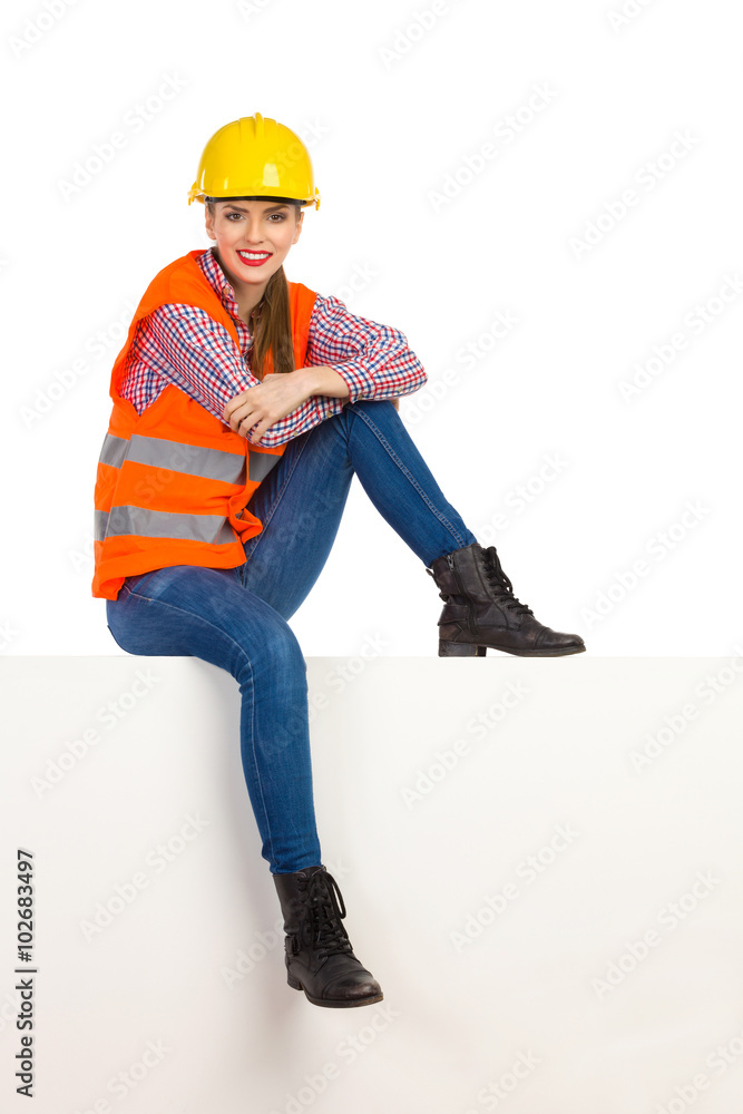Female Construction Worker Sitting And Waiting Female Construction Worker Sitting And Waiting