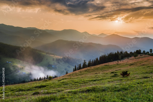 Carpathian Mountains. Mountain village on the green slopes Dzembronya