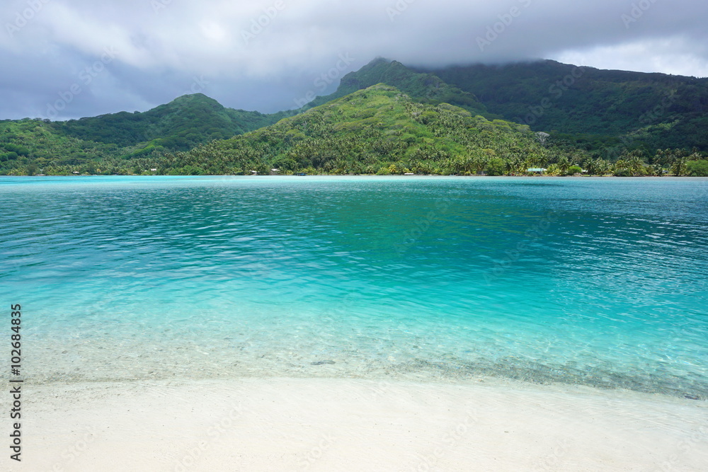 Landscape Huahine island from white sand beach