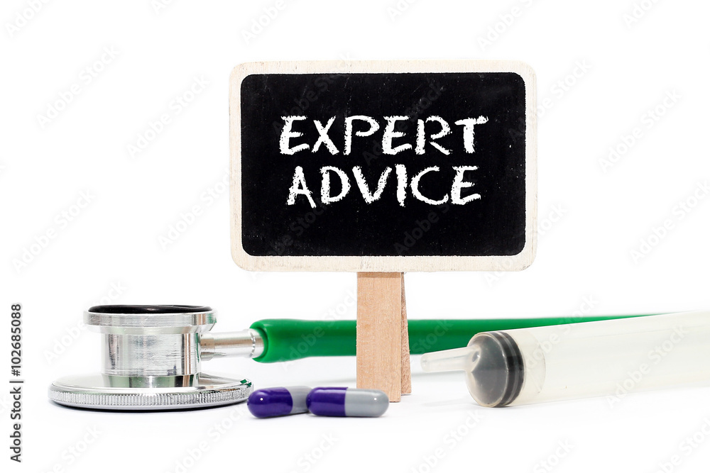 EXPERT ADVICE concept with text on chalkboard with stethoscope, syringe and pills