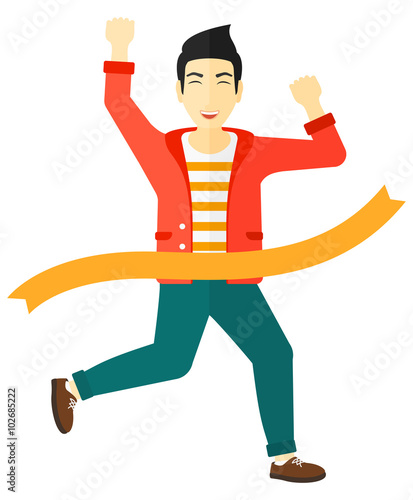 Businessman crossing finish line.