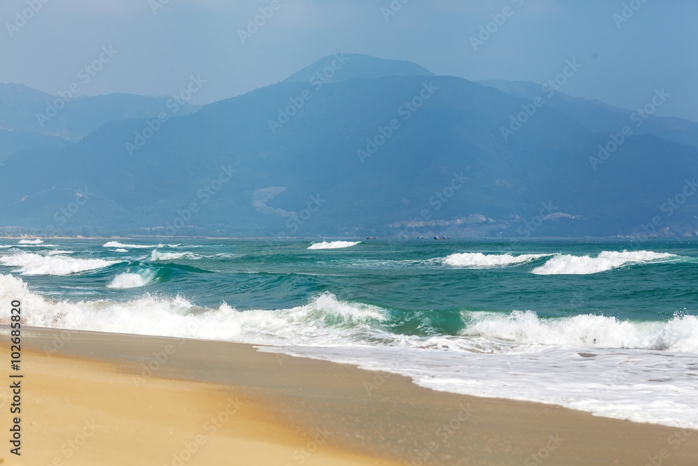 Sea landscape with views of the mountains and the yellow sand Sea landscape with views of the mountains and the yellow sand