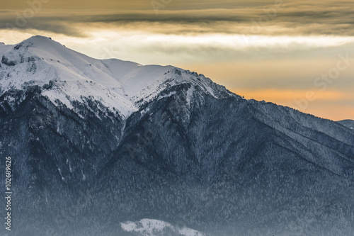 Bild auf Leinwand Sunset landscape over the Romanian Bucegi Mountains in winter season