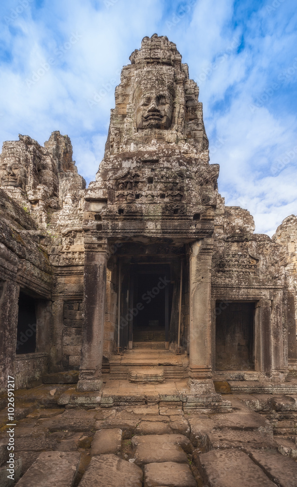 SIEM REAP, CAMBODIA. Ancient stone faces of Bayon temple, Angkor Thom