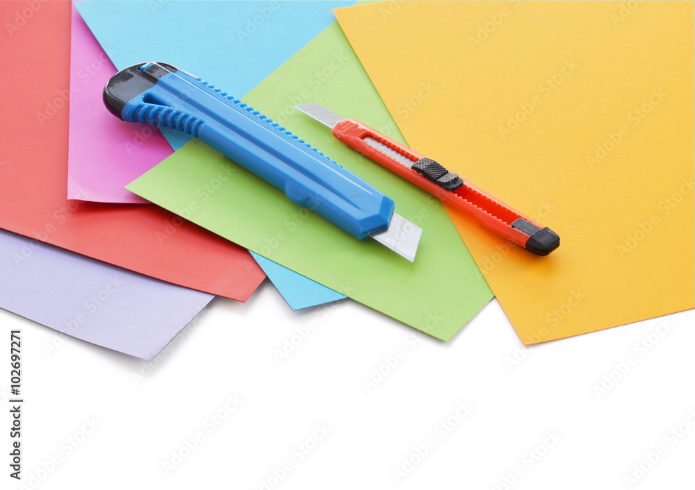 Sheets of colored paper and small stationery knife. Sheets of colored paper and small stationery knife.