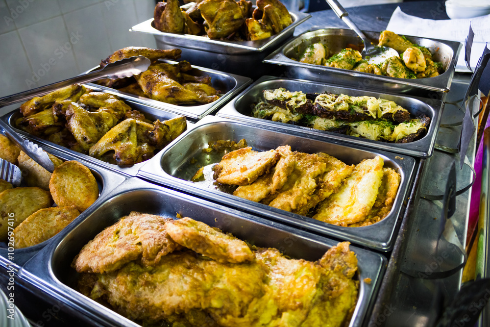 Counters with meat dishes in a cafe