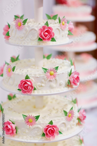 White wedding cake decorated with flowers