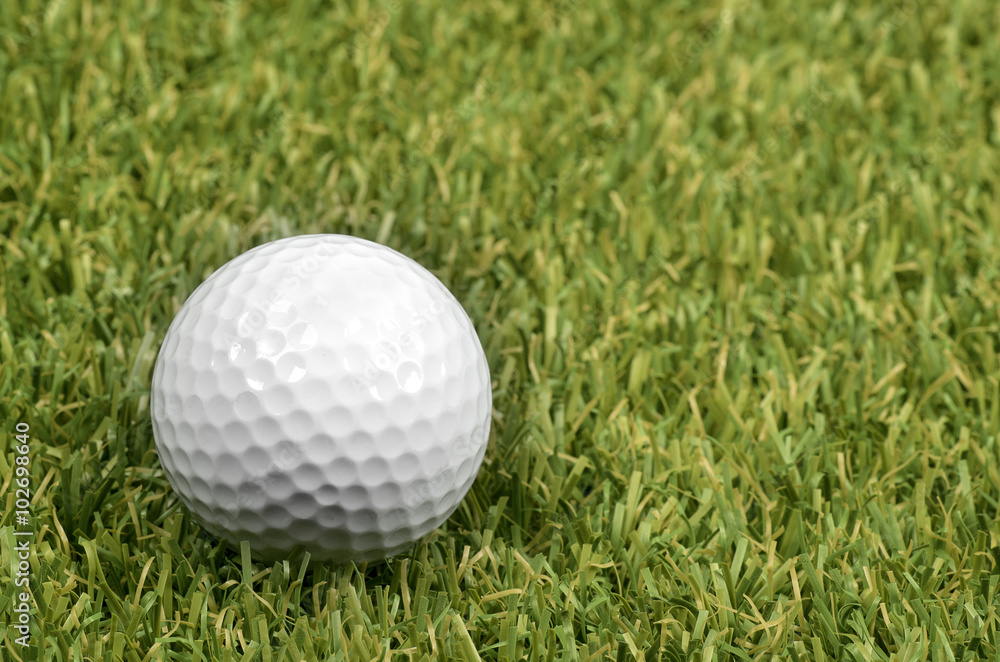 Golf ball on course with green grass. Golf ball on course with green grass.