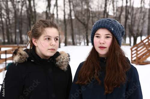 two teenage girls close up winter  portrait photo