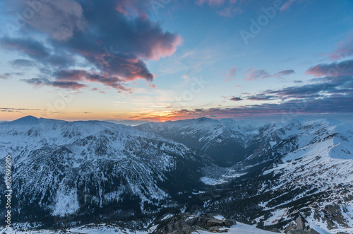 Colorful mountain sunset panorama at winter in Western Tatras © tomeyk
