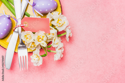 Easter table place setting on pink background  top view  place for text.