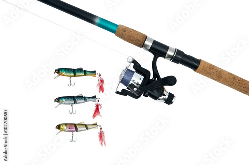 Spinning rod, reel and fishing baits isolated on white backgroun